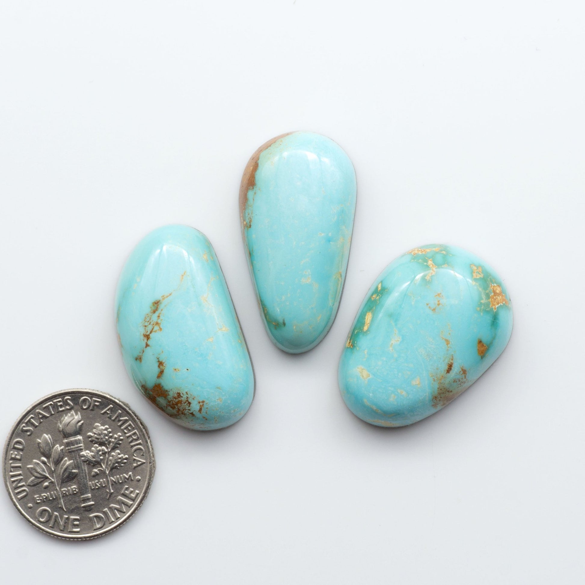 Royston Turquoise cabochons are famous for their distinctive matrix and unique green and blue hues, making them a favored option among jewelry designers.