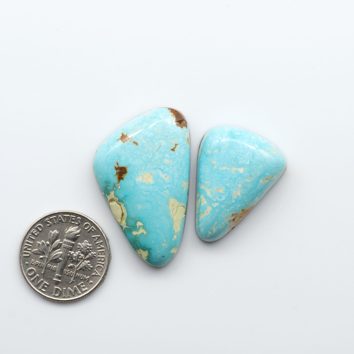 Royston Turquoise cabochons are famous for their distinctive matrix and unique green and blue hues, making them a favored option among jewelry designers.