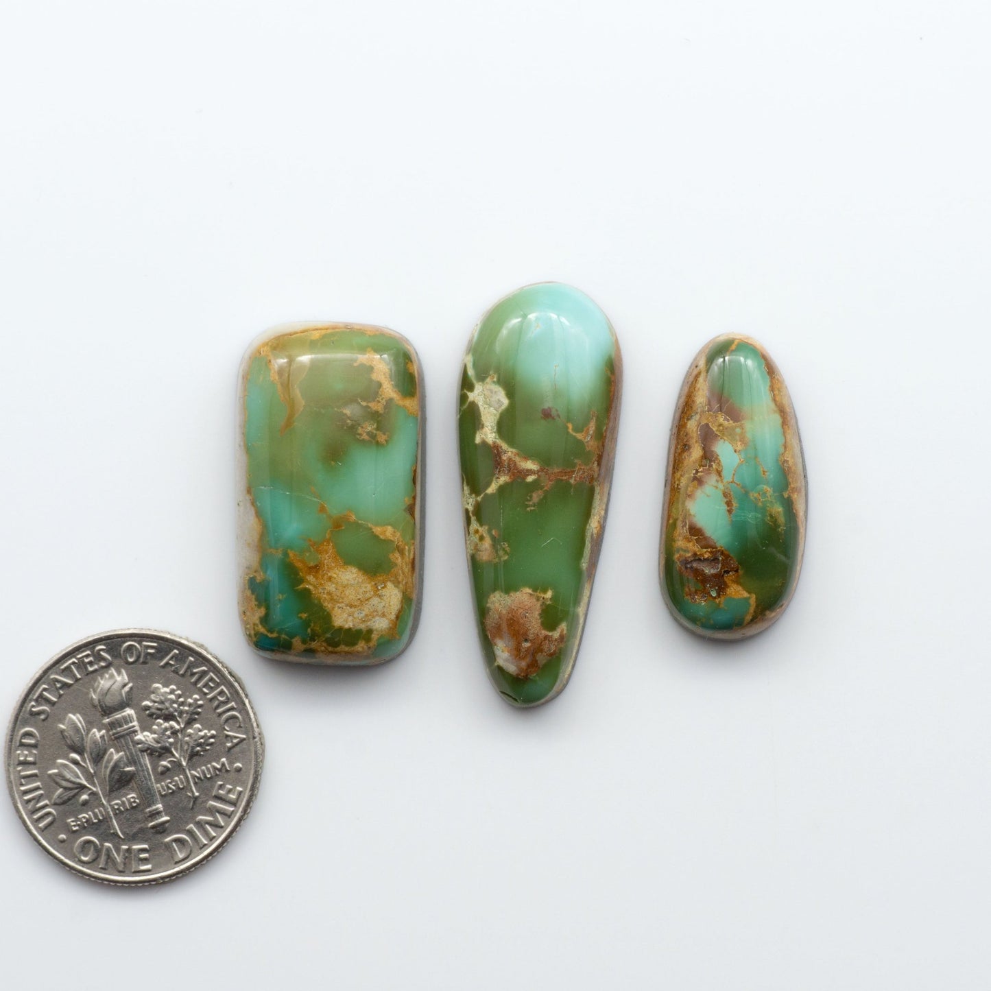 Royston Turquoise cabochons are famous for their distinctive matrix and unique green and blue hues, making them a favored option among jewelry designers.