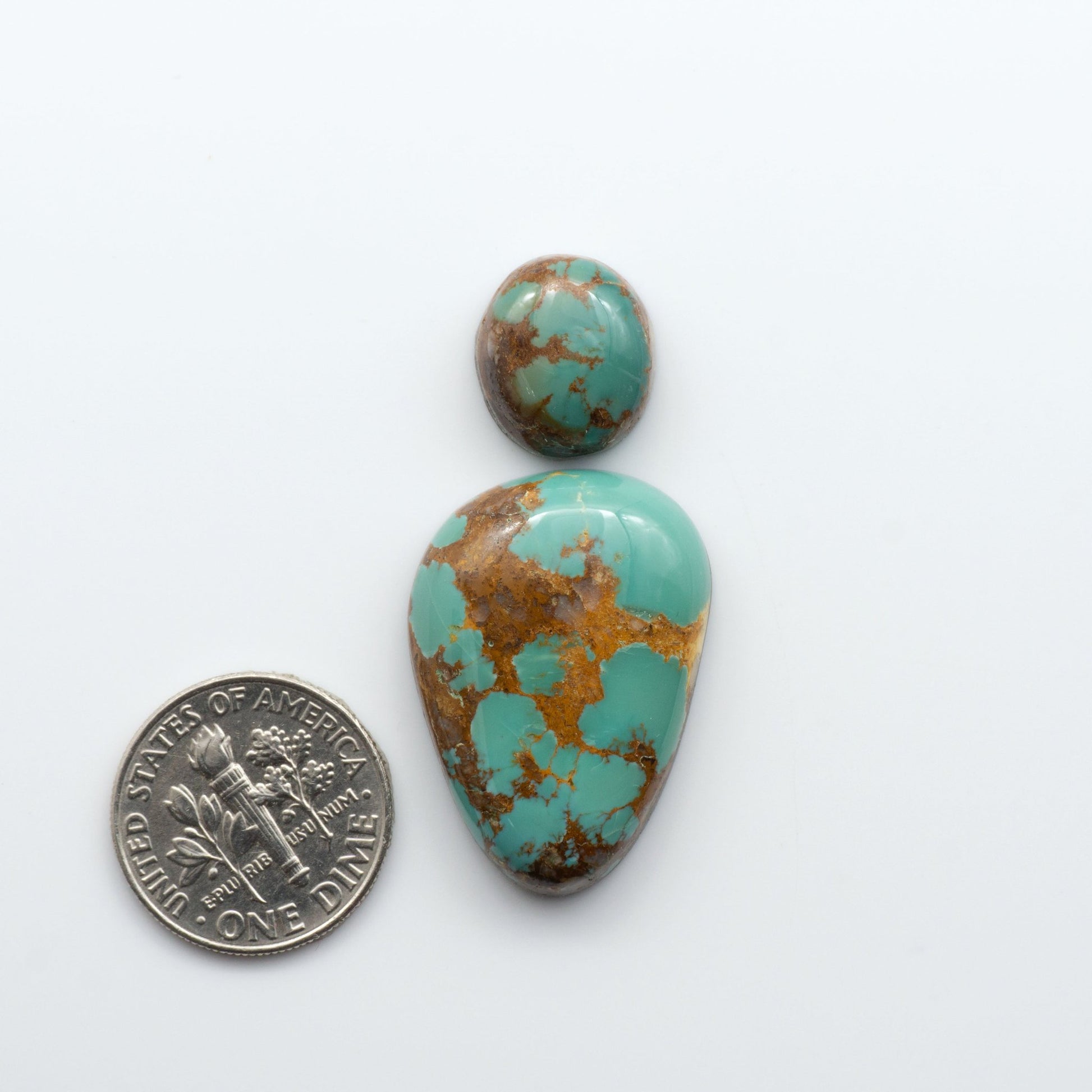 Royston Turquoise cabochons are famous for their distinctive matrix and unique green and blue hues, making them a favored option among jewelry designers.