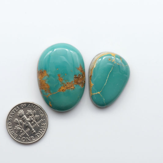 Royston Turquoise cabochons are famous for their distinctive matrix and unique green and blue hues, making them a favored option among jewelry designers.