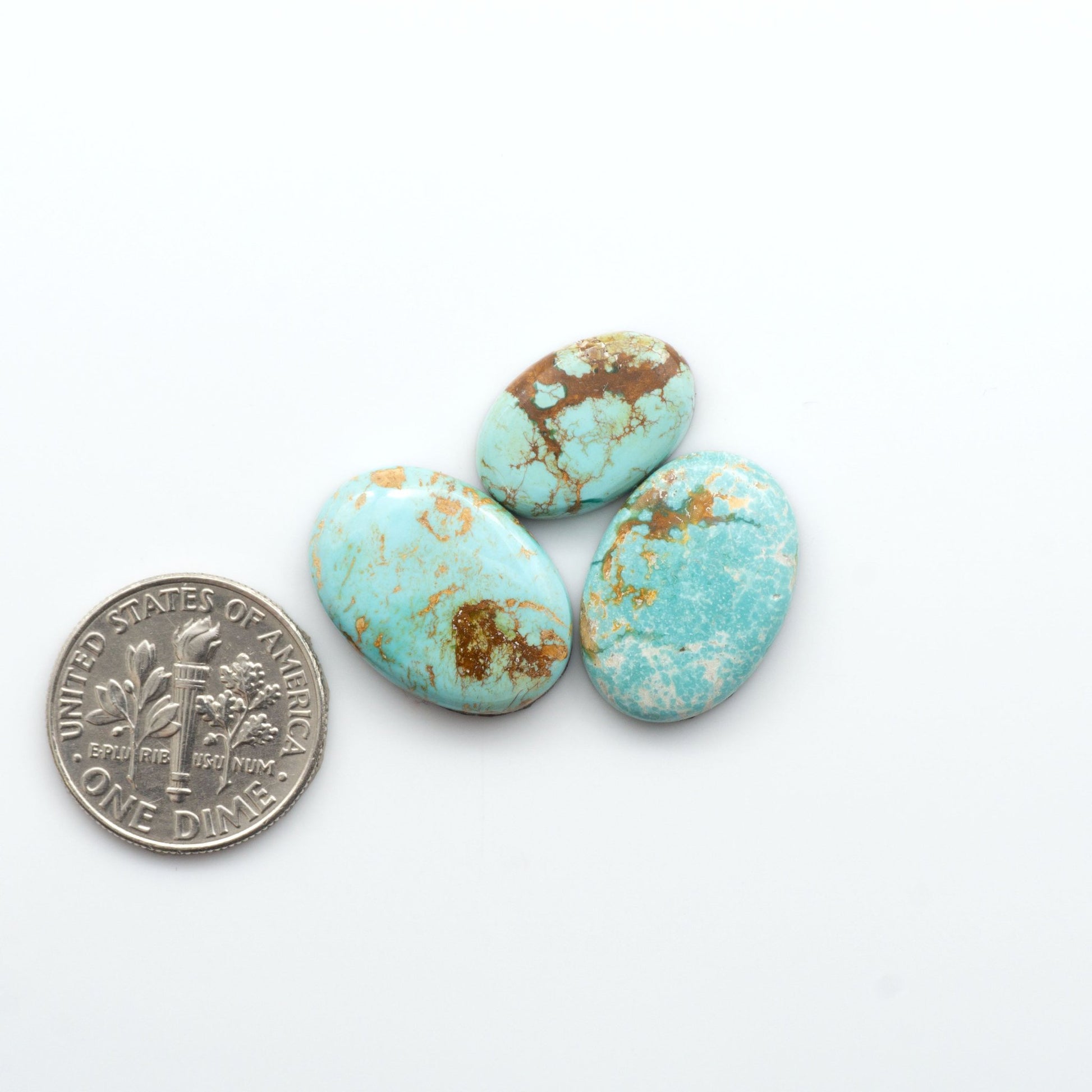 Royston Turquoise cabochons are famous for their distinctive matrix and unique green and blue hues, making them a favored option among jewelry designers.