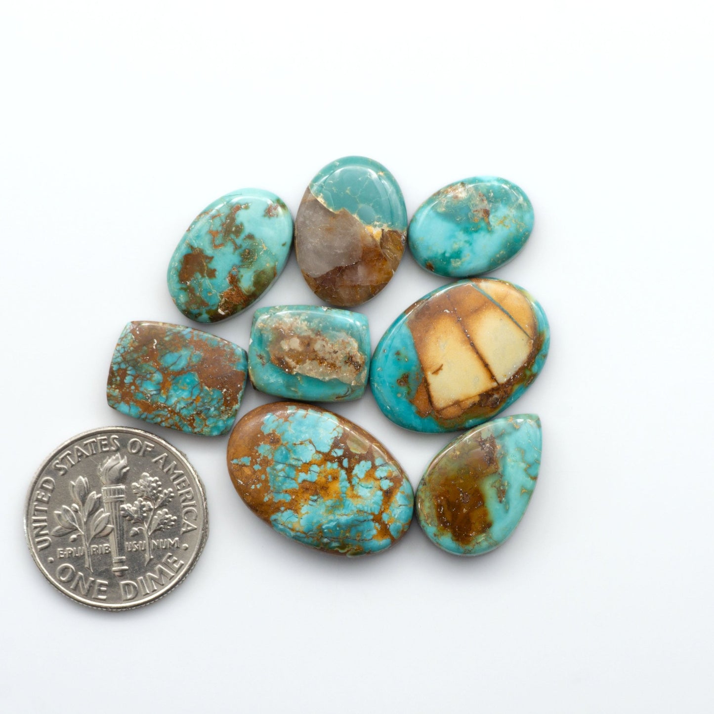 Royston Turquoise cabochons are famous for their distinctive matrix and unique green and blue hues, making them a favored option among jewelry designers.