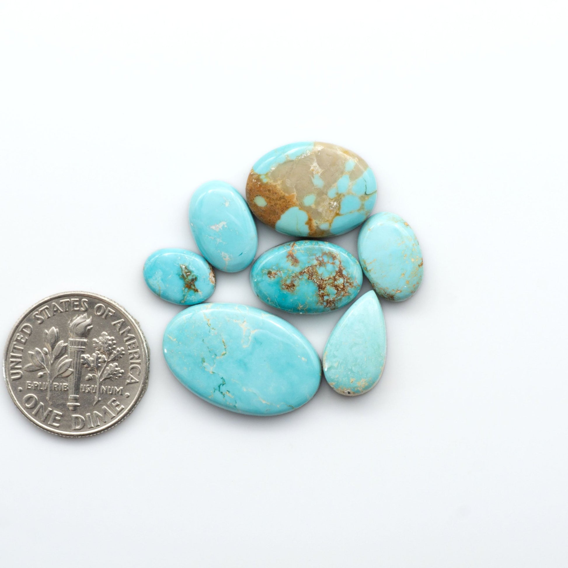 Royston Turquoise cabochons are famous for their distinctive matrix and unique green and blue hues, making them a favored option among jewelry designers.