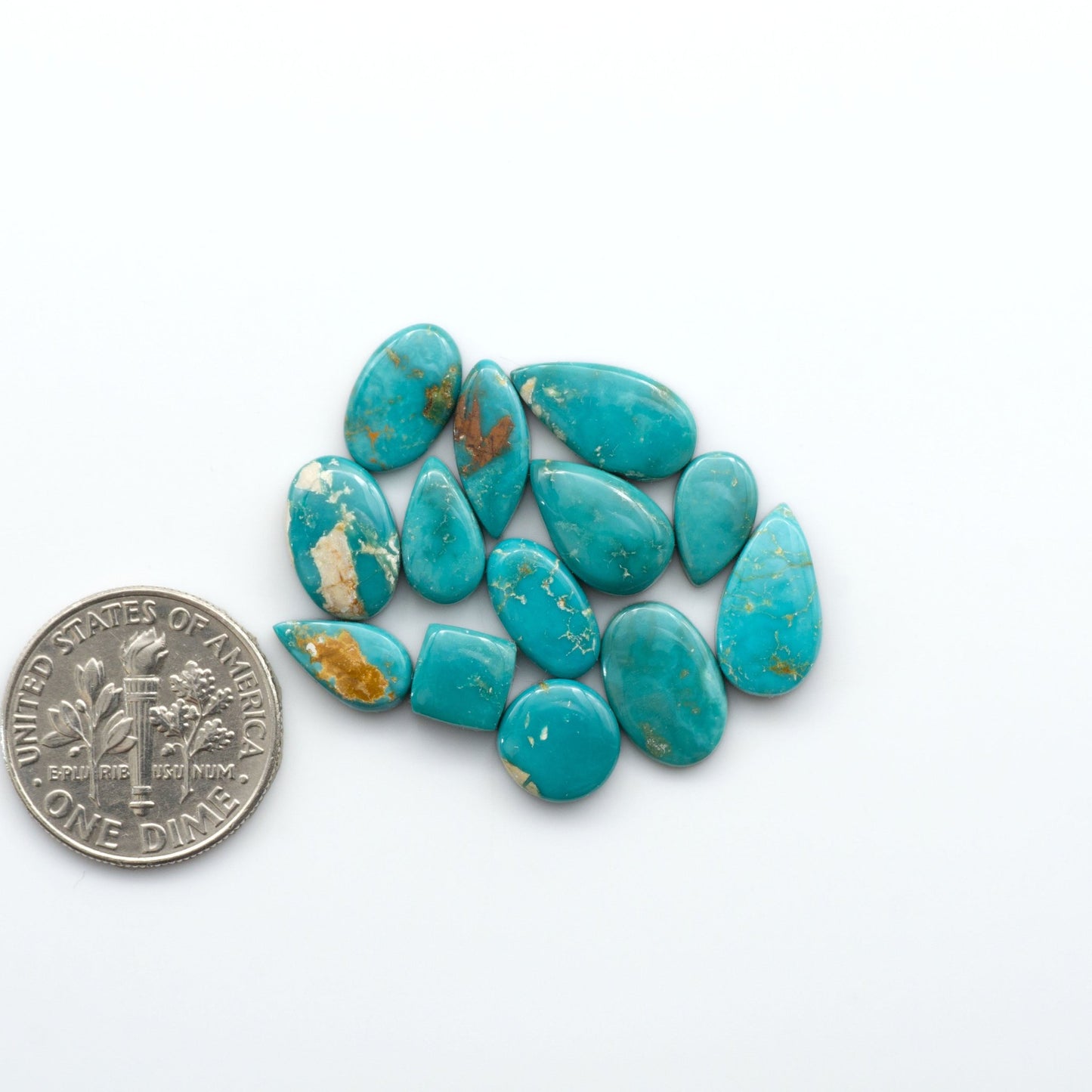 Royston Turquoise cabochons are famous for their distinctive matrix and unique green and blue hues, making them a favored option among jewelry designers.