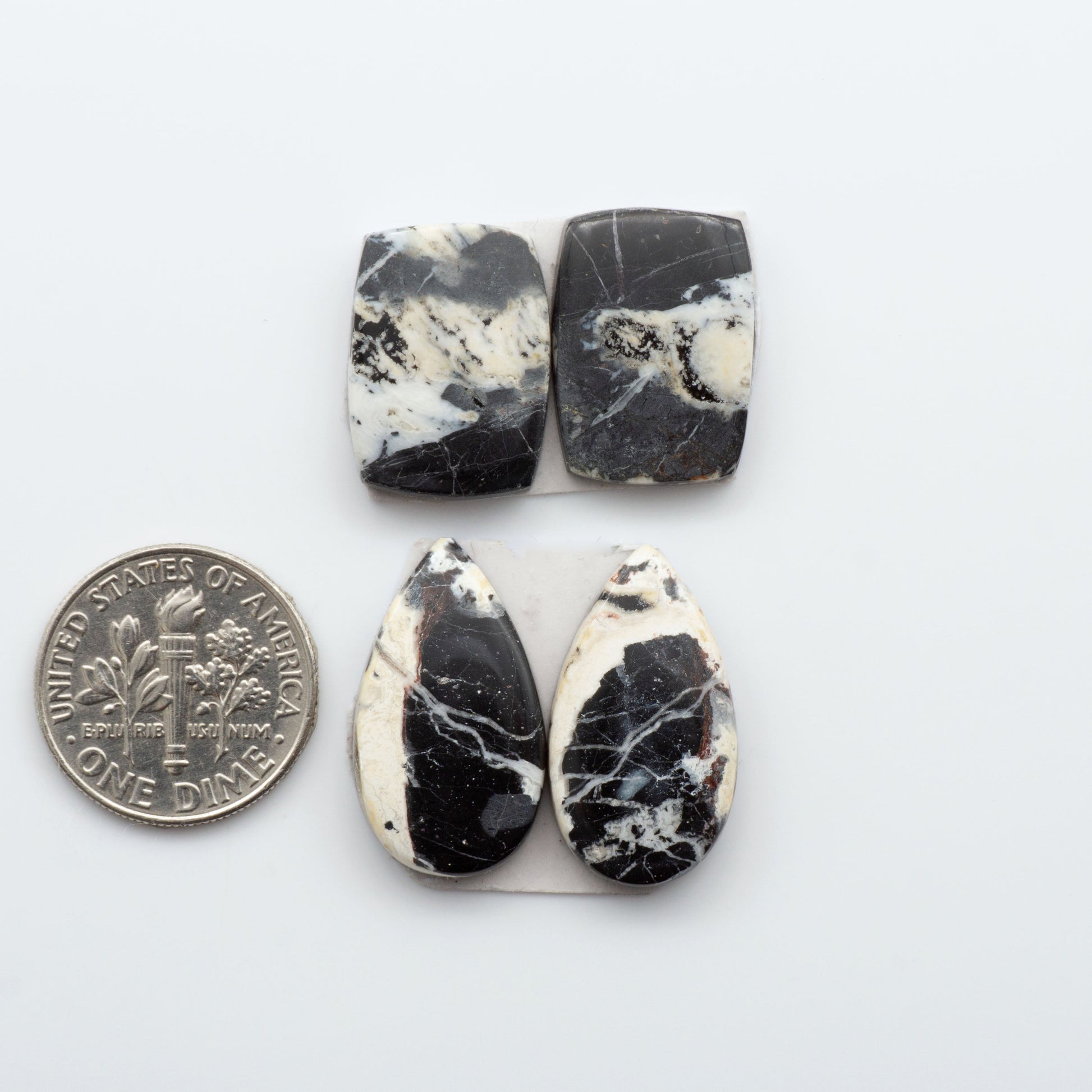 Our Natural White Buffalo Stone Cabochons are semi-precious gemstones cut into shapes ideal for jewelry-making. Making them an excellent choice for artisans.