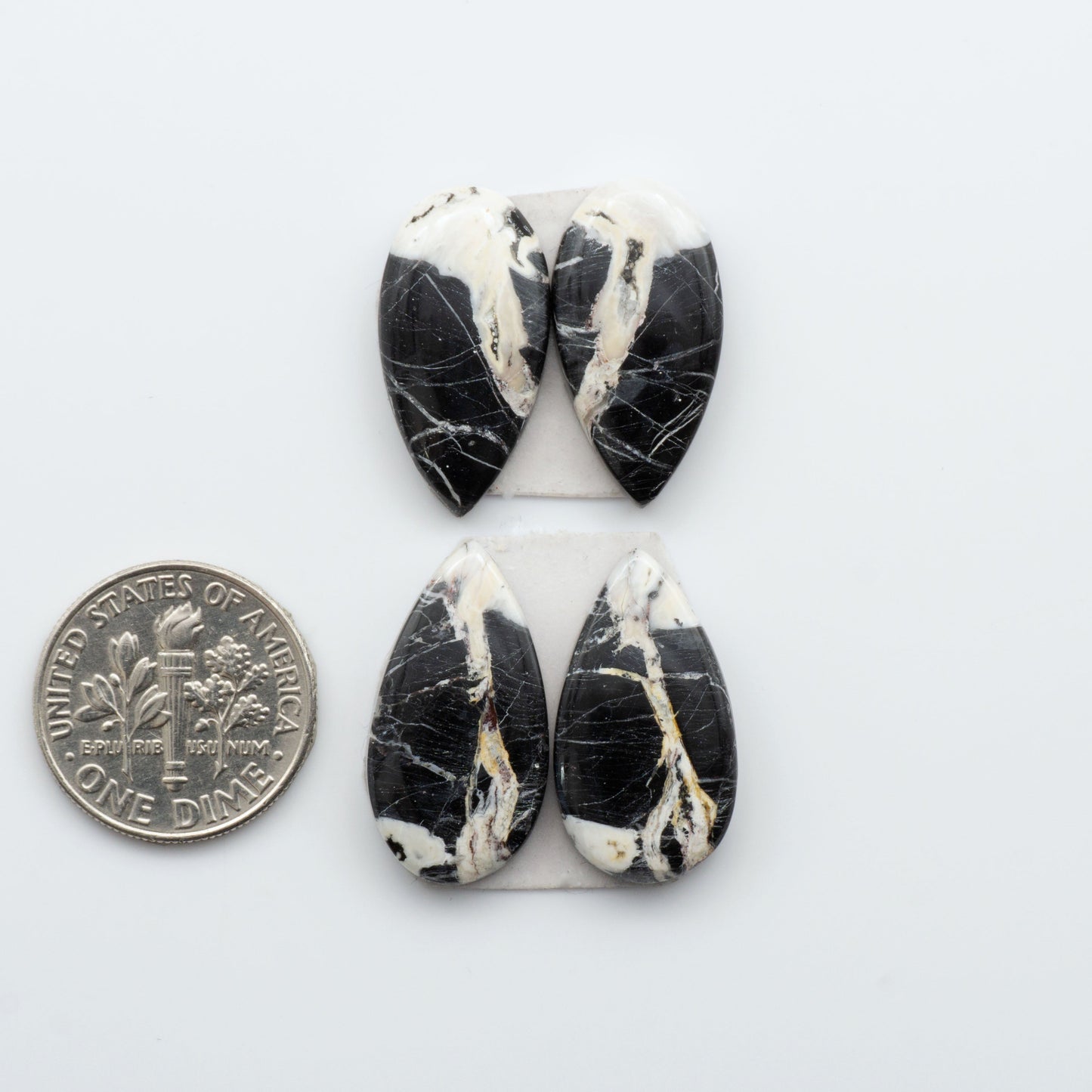 Our Natural White Buffalo Stone Cabochons are semi-precious gemstones cut into shapes ideal for jewelry-making. Making them an excellent choice for artisans.