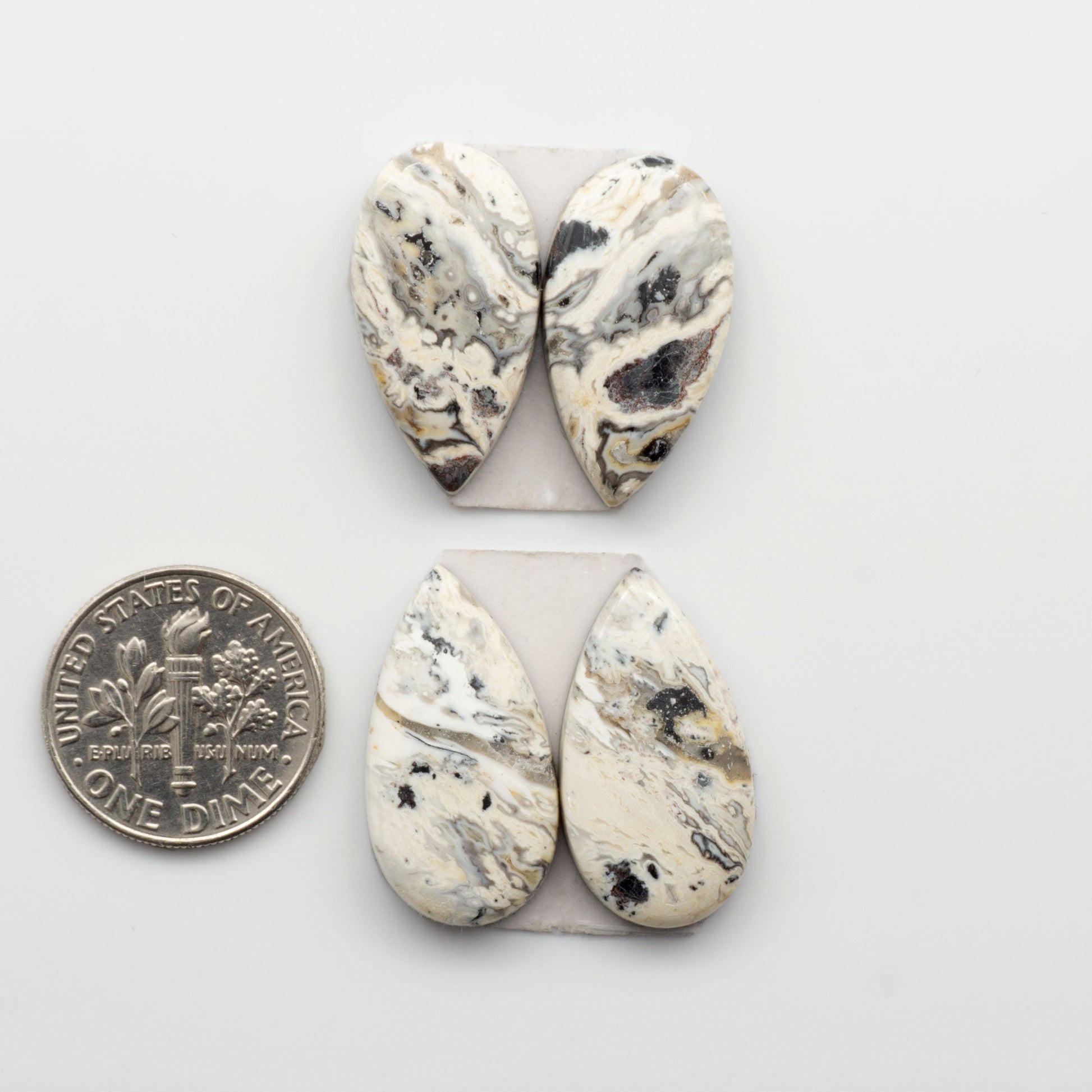 Our Natural White Buffalo Stone Cabochons are semi-precious gemstones cut into shapes ideal for jewelry-making. Making them an excellent choice for artisans.