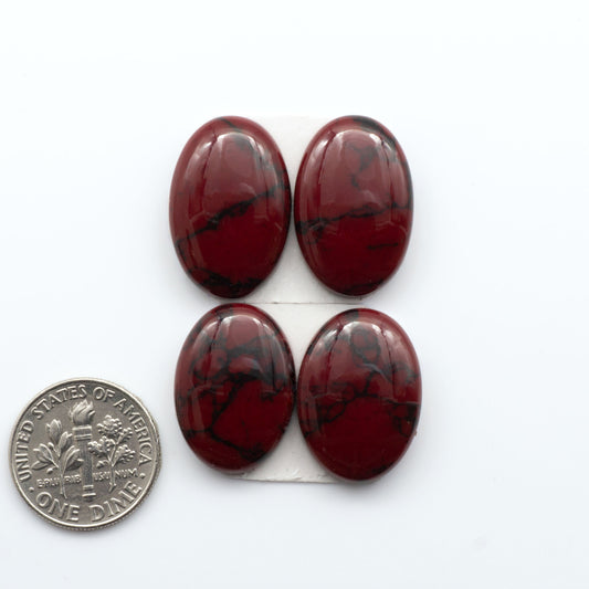 Bloody Bison Jasper is a composite stone with a vibrant red hue and black matrix that creates a strong impression and a touch of opulence to any jewelry piece.