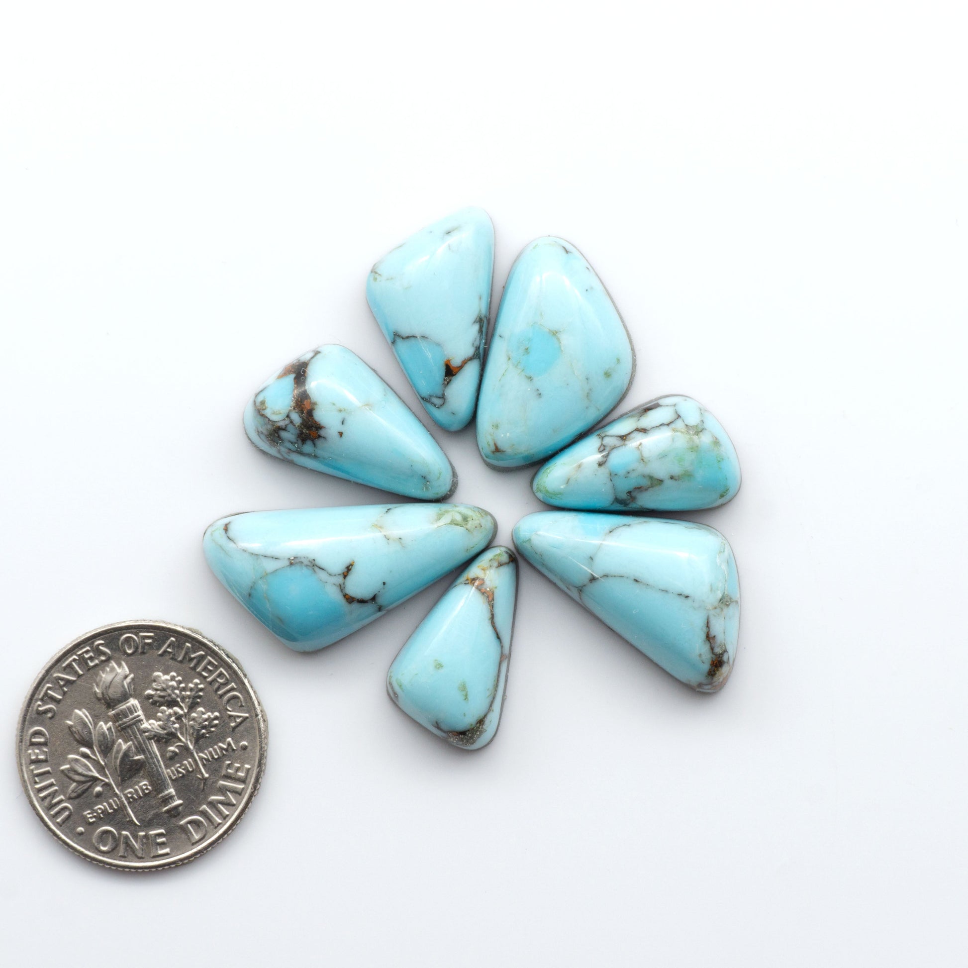 Enhance your jewelry designs with Pressed Turquoise Nugget Cabochons. Crafted from composite materials they add a captivating touch to your creations.