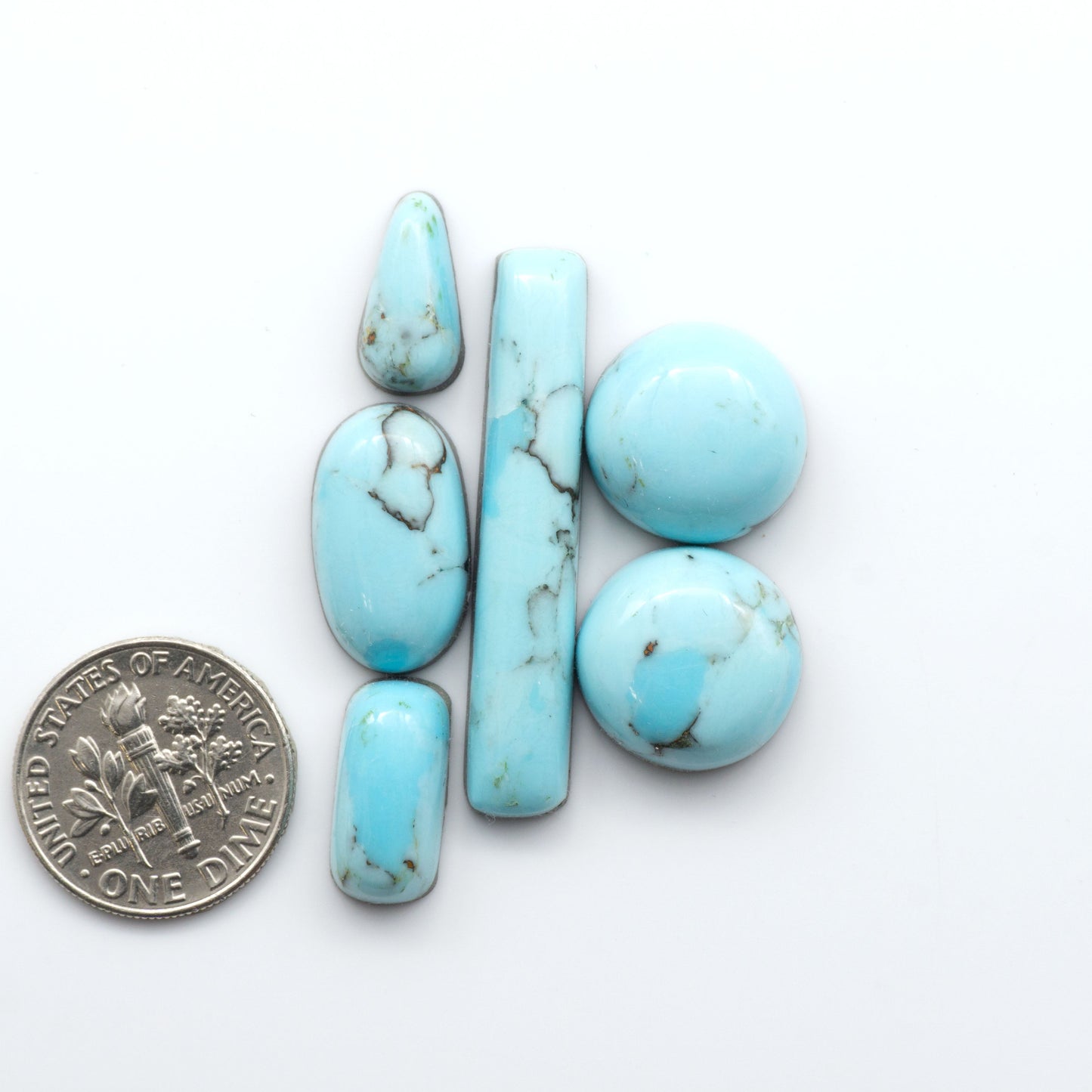 Enhance your jewelry designs with Pressed Turquoise Nugget Cabochons. Crafted from composite materials they add a captivating touch to your creations.