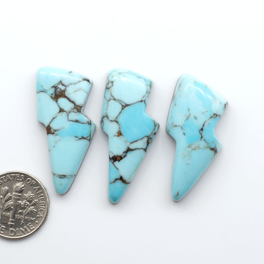 Enhance your jewelry designs with Pressed Turquoise Nugget Cabochons. Crafted from composite materials they add a captivating touch to your creations.