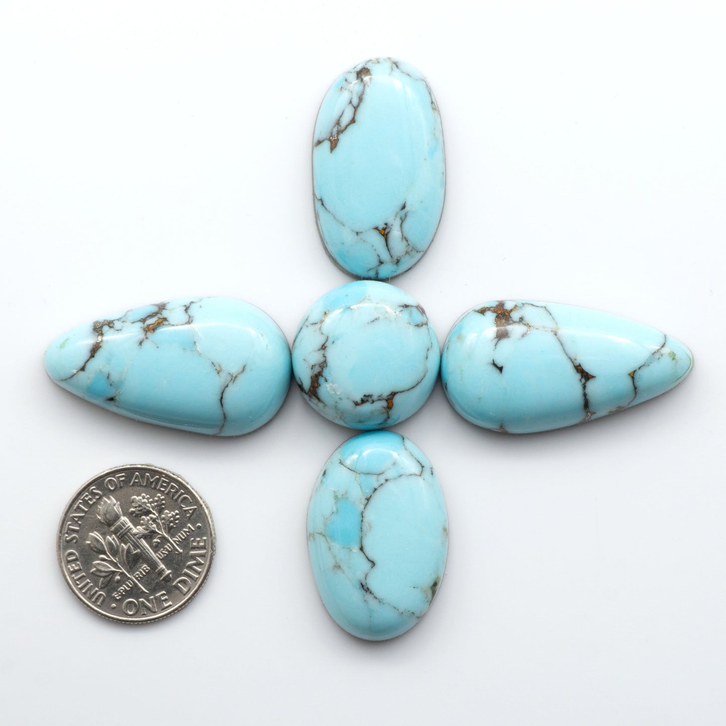 Enhance your jewelry designs with Pressed Turquoise Nugget Cabochons. Crafted from composite materials they add a captivating touch to your creations.