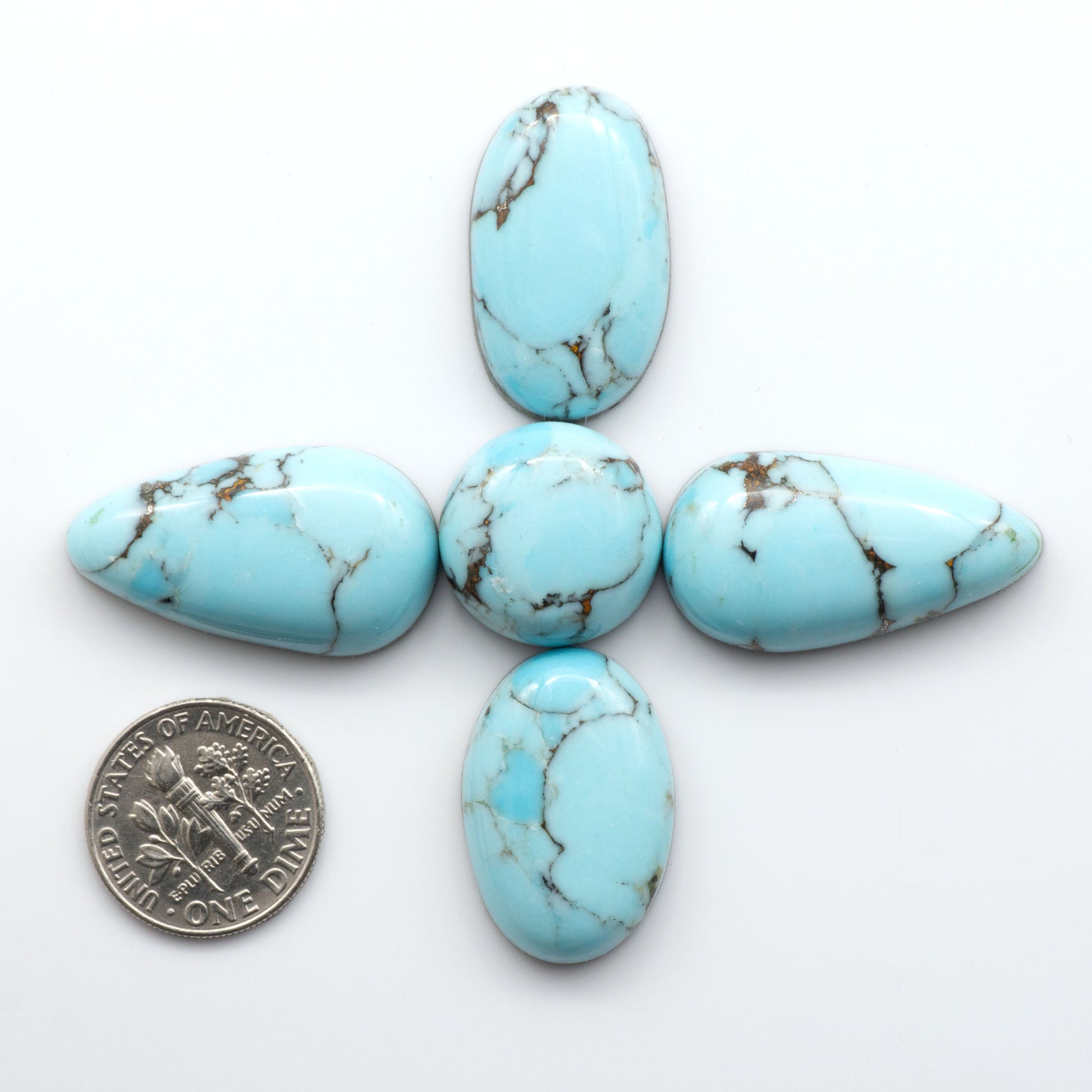 Enhance your jewelry designs with Pressed Turquoise Nugget Cabochons. Crafted from composite materials they add a captivating touch to your creations.