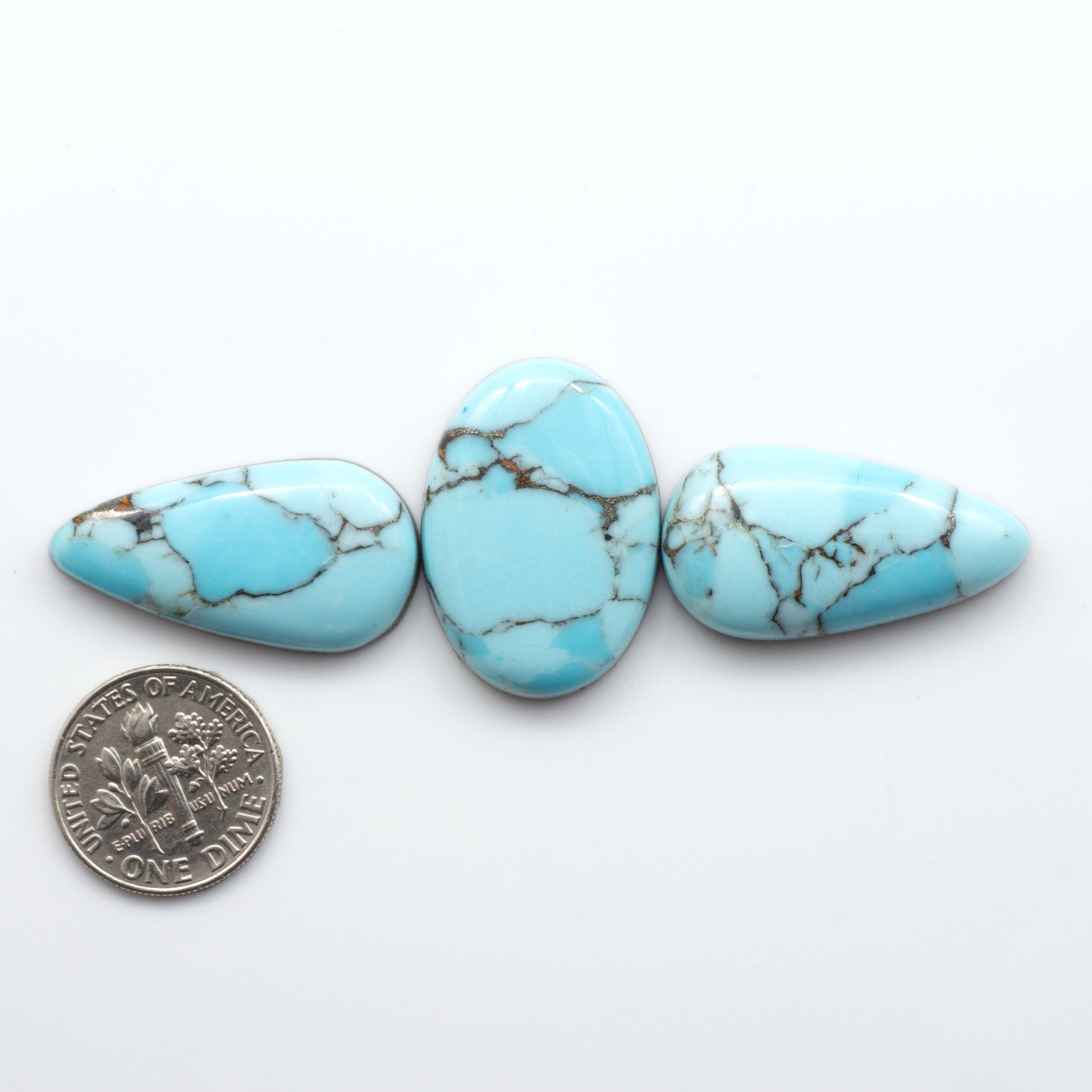 Enhance your jewelry designs with Pressed Turquoise Nugget Cabochons. Crafted from composite materials they add a captivating touch to your creations.