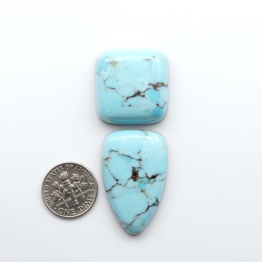 Enhance your jewelry designs with Pressed Turquoise Nugget Cabochons. Crafted from composite materials they add a captivating touch to your creations.