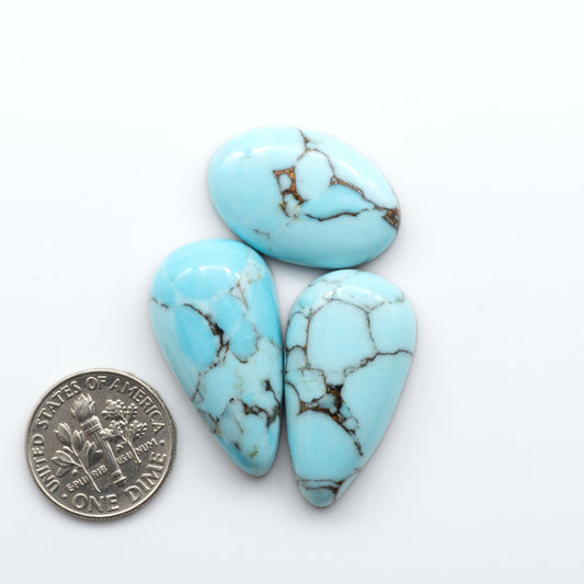 Enhance your jewelry designs with Pressed Turquoise Nugget Cabochons. Crafted from composite materials they add a captivating touch to your creations.