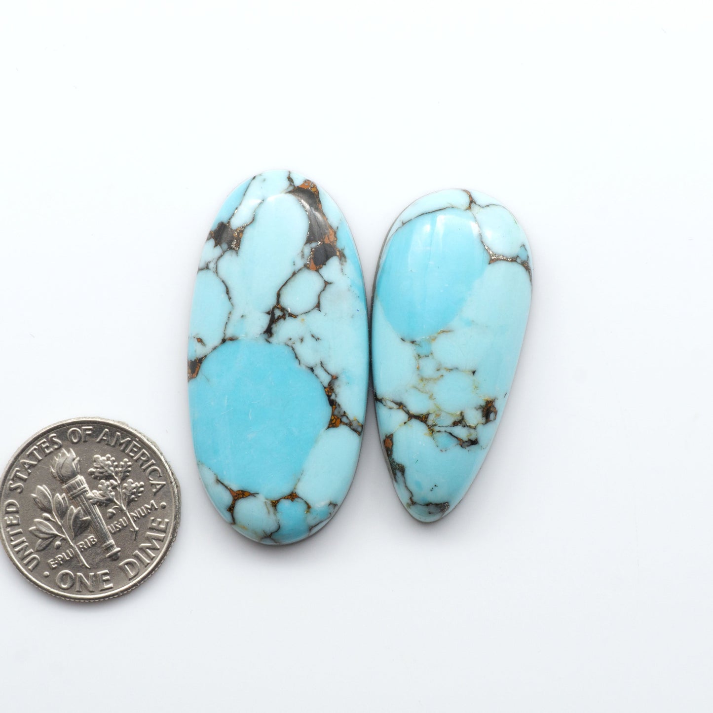 Enhance your jewelry designs with Pressed Turquoise Nugget Cabochons. Crafted from composite materials they add a captivating touch to your creations.