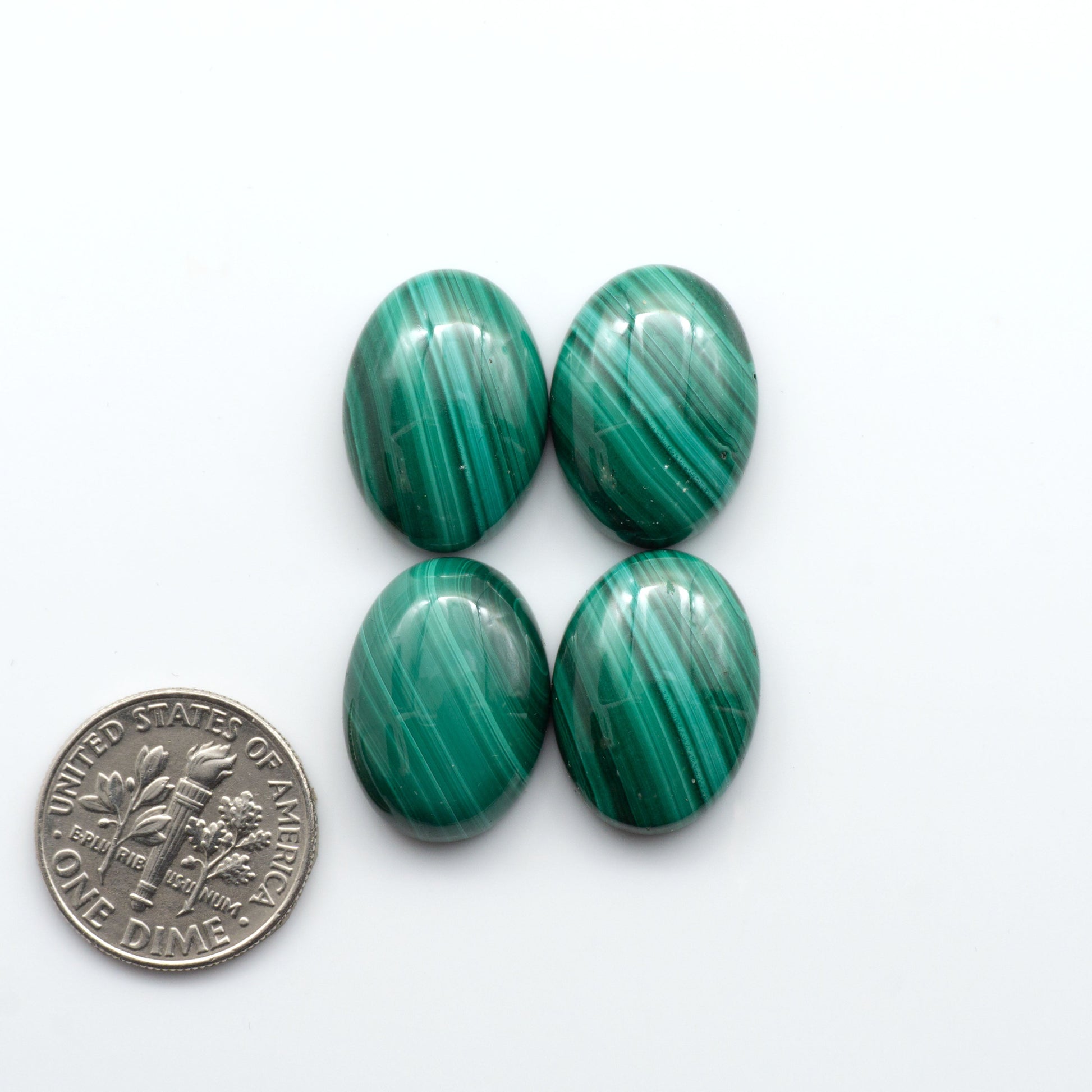 These Malachite Cabochons feature a rich green color and unique swirling patterns, making them a stunning addition to any jewelry or craft project. 