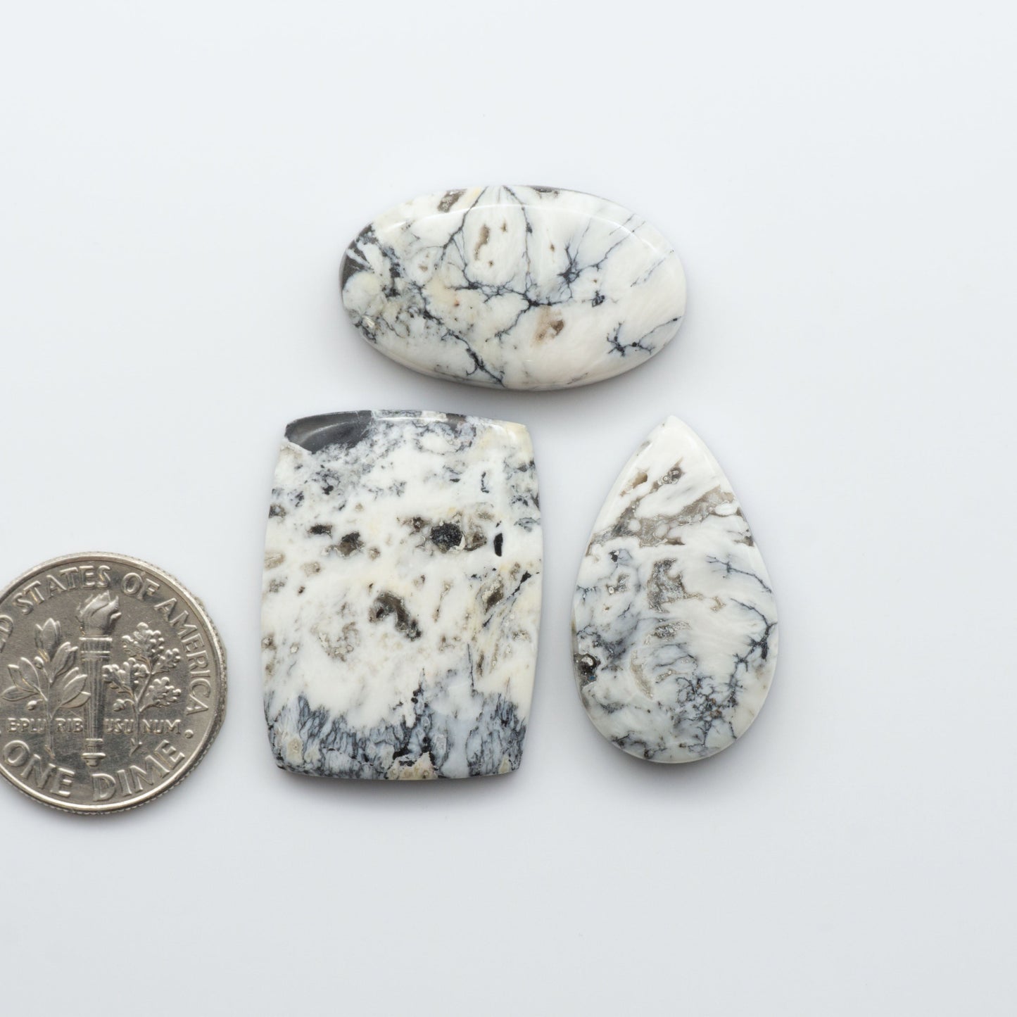 Natural White Buffalo Stone Cabochons are semi-precious gemstones cut into shapes ideal for jewelry-making and crafting and are backed for added strength. 