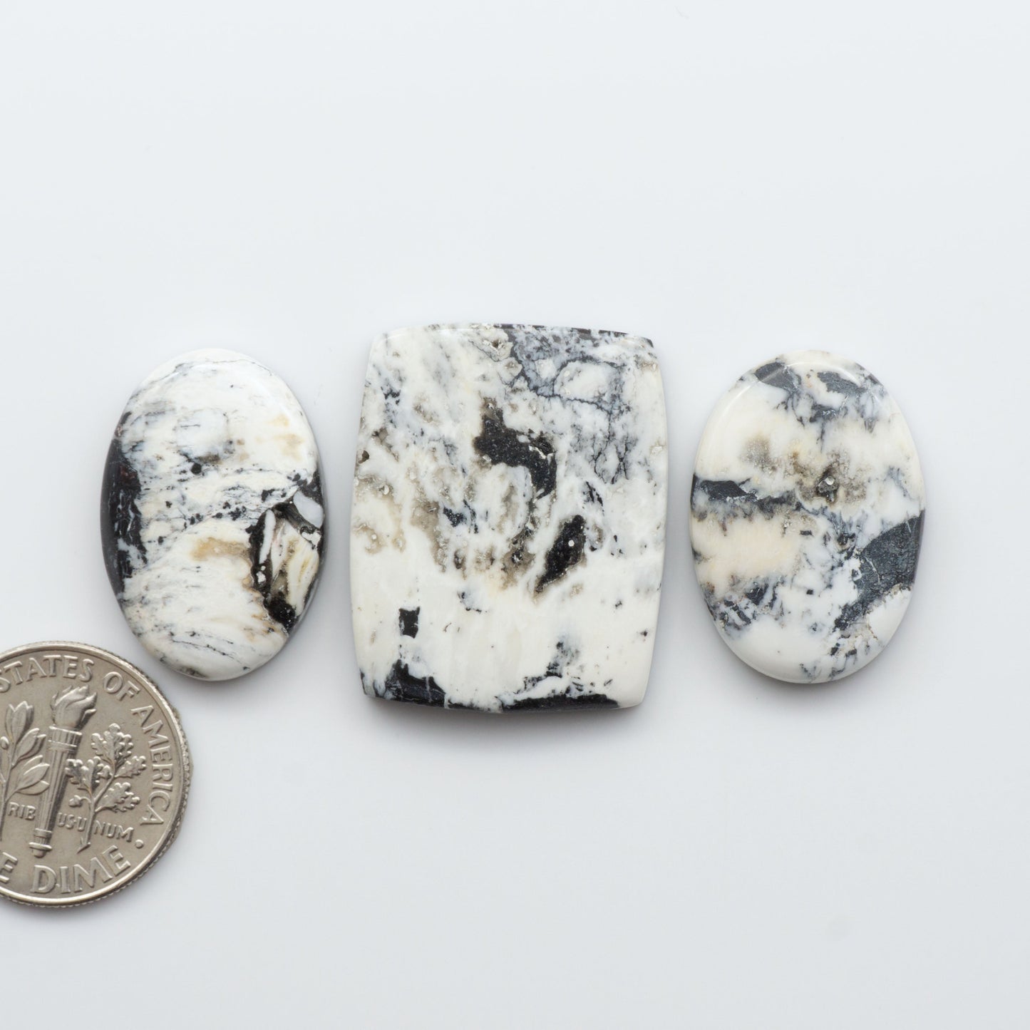 Natural White Buffalo Stone Cabochons are semi-precious gemstones cut into shapes ideal for jewelry-making and crafting and are backed for added strength. 