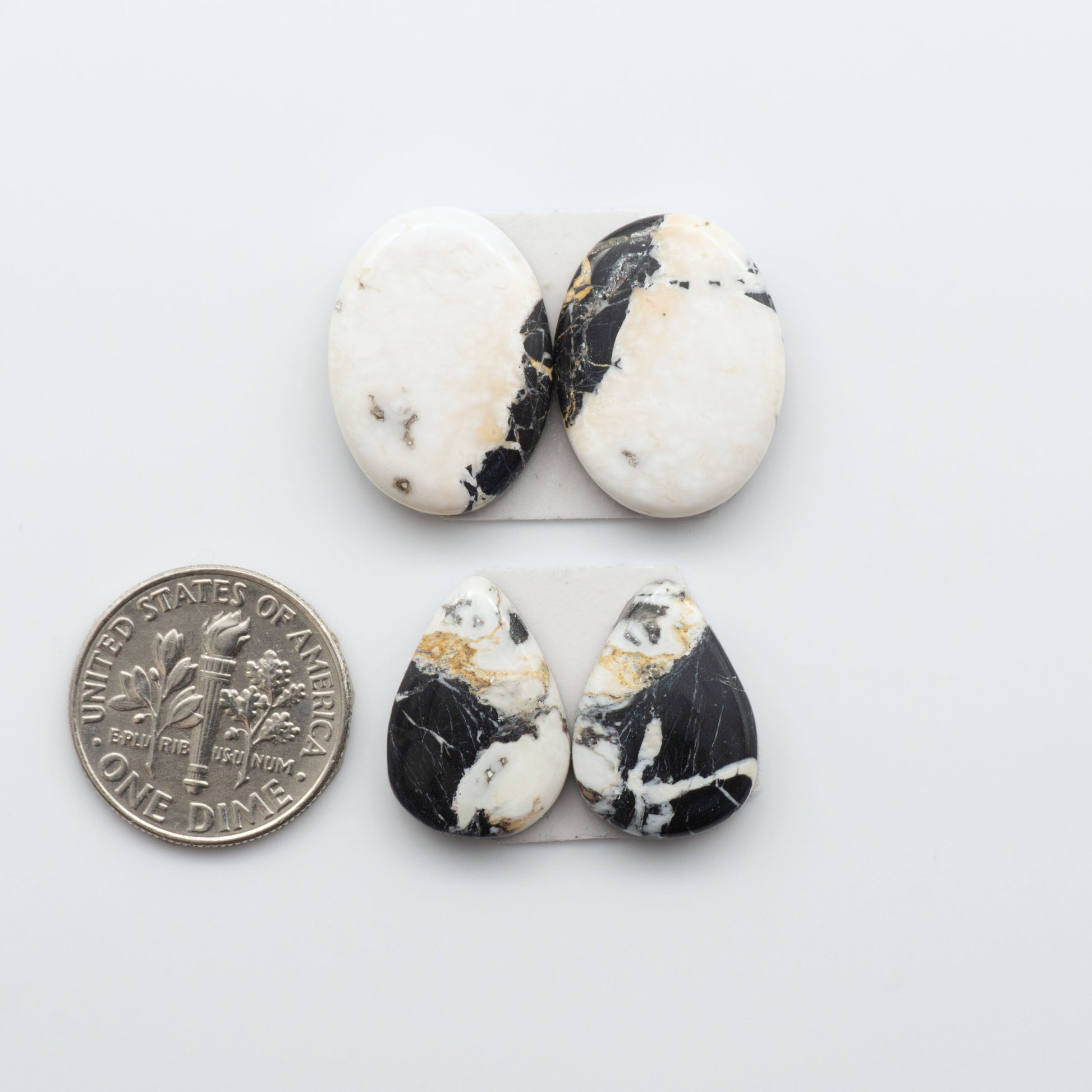 Natural White Buffalo Stone Cabochons are semi-precious gemstones cut into shapes ideal for jewelry-making, making them an excellent choice for artisans.