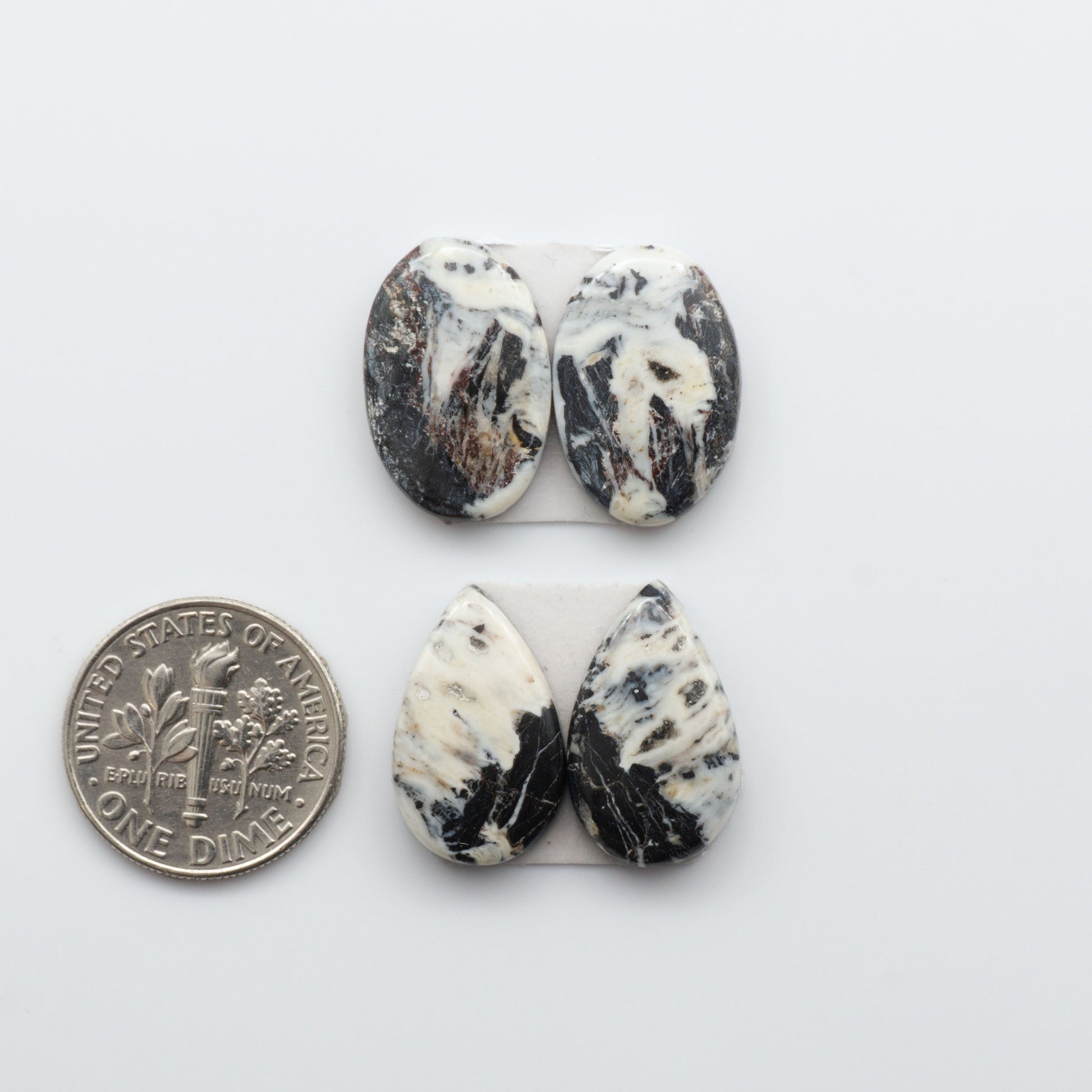 Natural White Buffalo Stone Cabochons are semi-precious gemstones cut into shapes ideal for jewelry-making, making them an excellent choice for artisans.