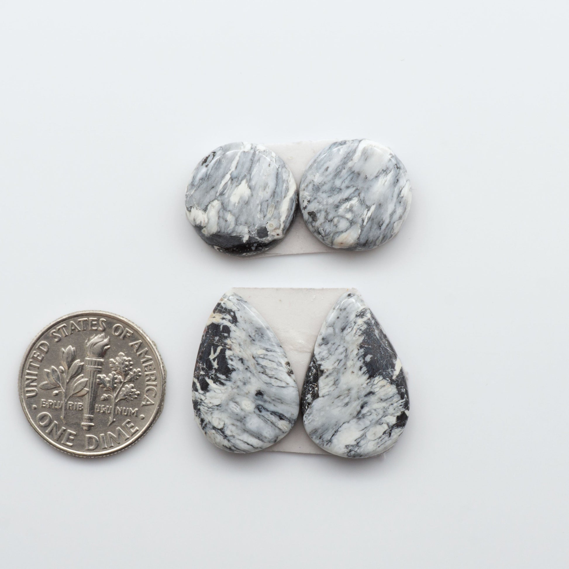 Natural White Buffalo Stone Cabochons are semi-precious gemstones cut into shapes ideal for jewelry-making, making them an excellent choice for artisans.