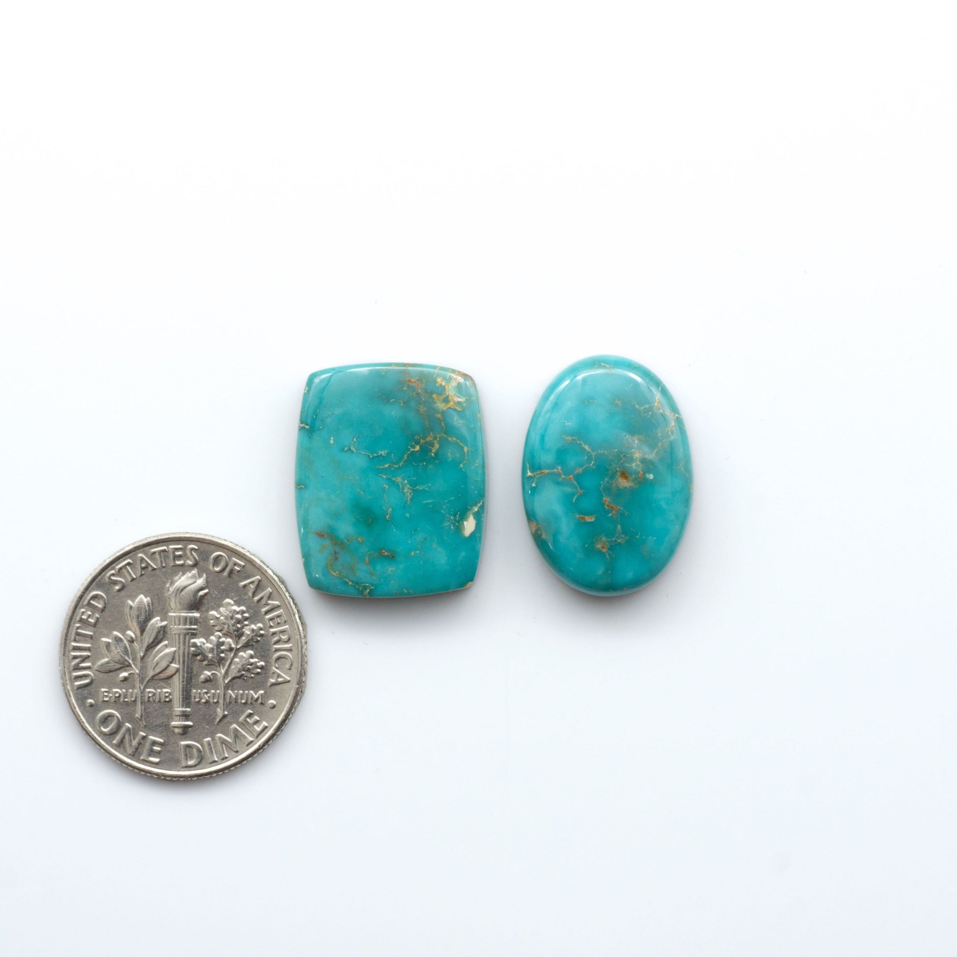 Royston Turquoise cabochons are famous for their distinctive matrix and unique green and blue hues, making them a favored option among jewelry designers.