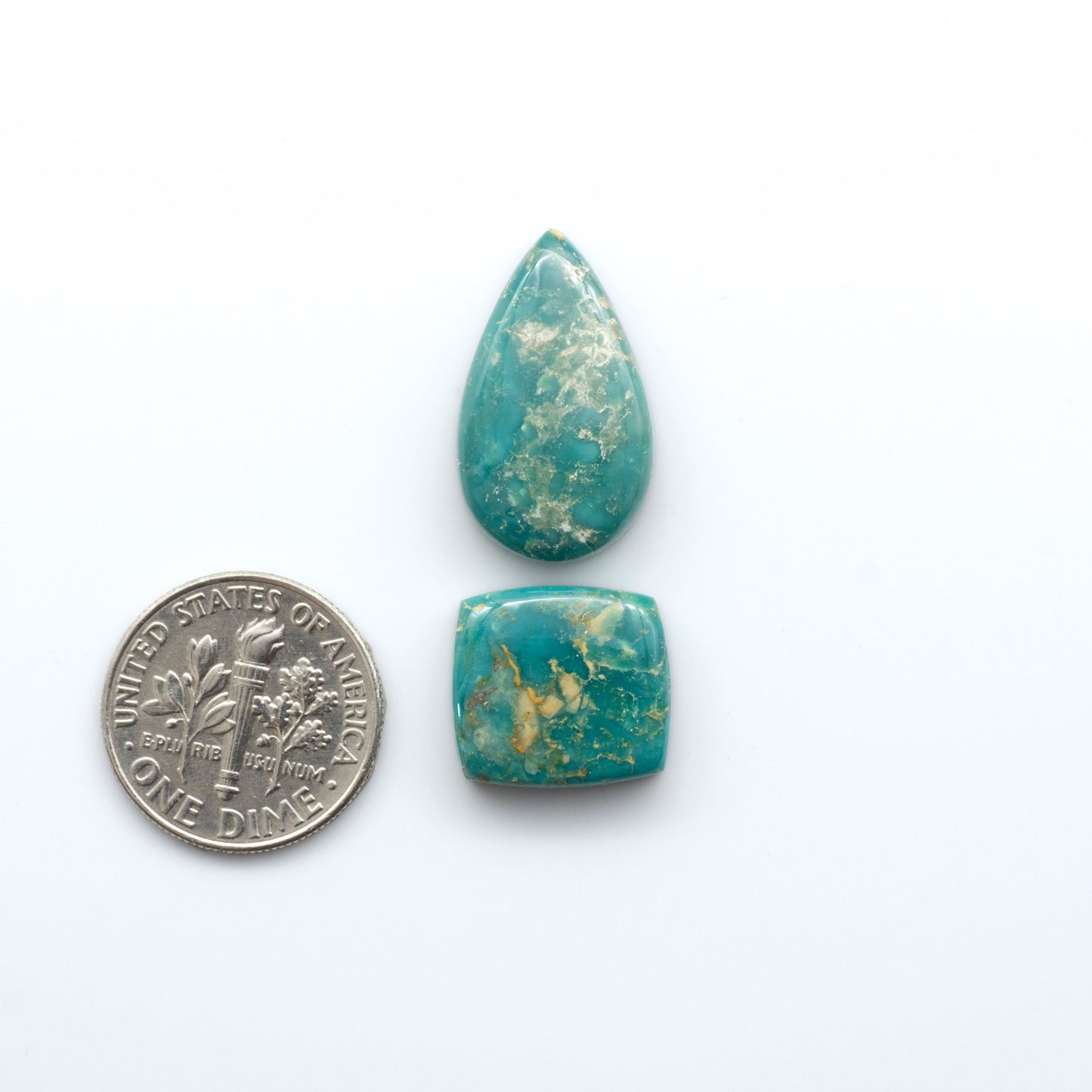 Royston Turquoise cabochons are famous for their distinctive matrix and unique green and blue hues, making them a favored option among jewelry designers.