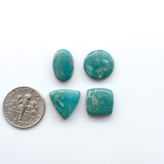 Royston Turquoise cabochons are famous for their distinctive matrix and unique green and blue hues, making them a favored option among jewelry designers.