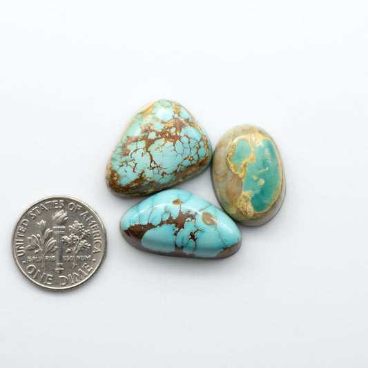 Royston Turquoise cabochons are famous for their distinctive matrix and unique green and blue hues, making them a favored option among jewelry designers.