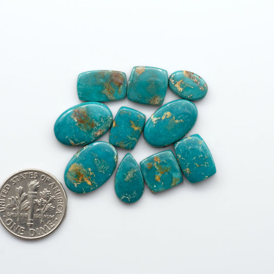 Royston Turquoise cabochons are famous for their distinctive matrix and unique green and blue hues, making them a favored option among jewelry designers.