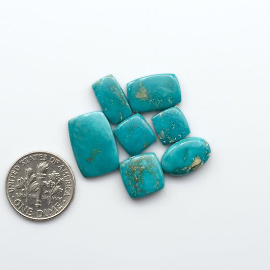 Royston Turquoise cabochons are famous for their distinctive matrix and unique green and blue hues, making them a favored option among jewelry designers.