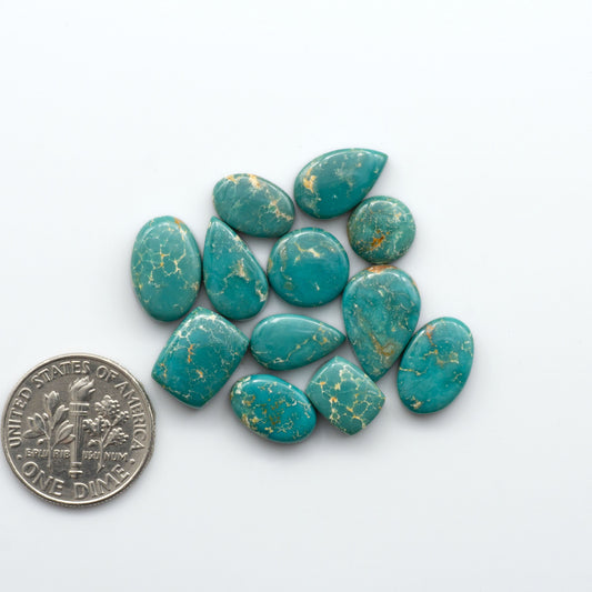 Royston Turquoise cabochons are famous for their distinctive matrix and unique green and blue hues, making them a favored option among jewelry designers.