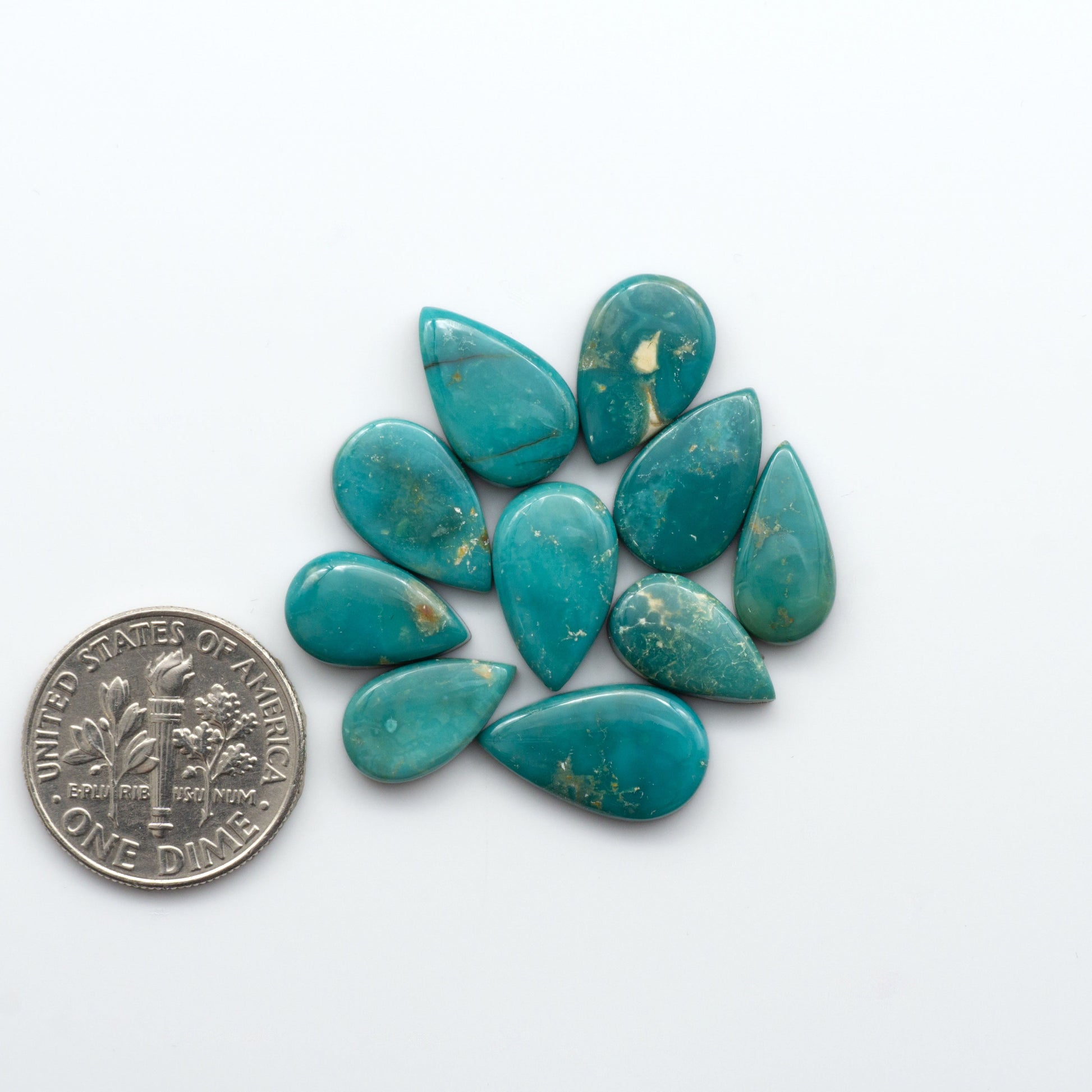 Royston Turquoise cabochons are famous for their distinctive matrix and unique green and blue hues, making them a favored option among jewelry designers.