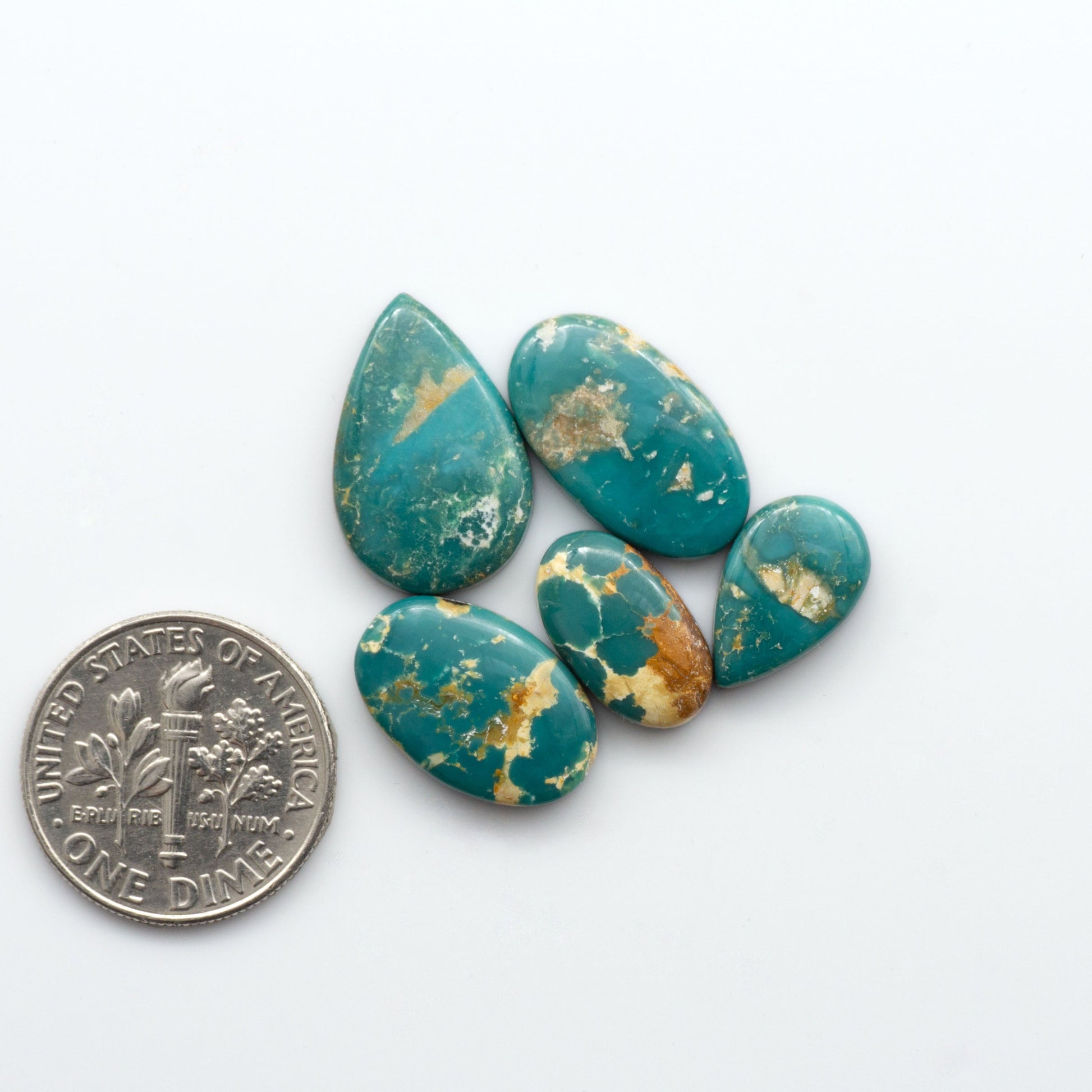 Royston Turquoise cabochons are famous for their distinctive matrix and unique green and blue hues, making them a favored option among jewelry designers.