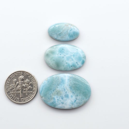 Discover the beauty of Larimar Cabochons. Cut to emphasize the stone's natural patterns and colors. Add a touch of natural beauty to your jewelry designs.