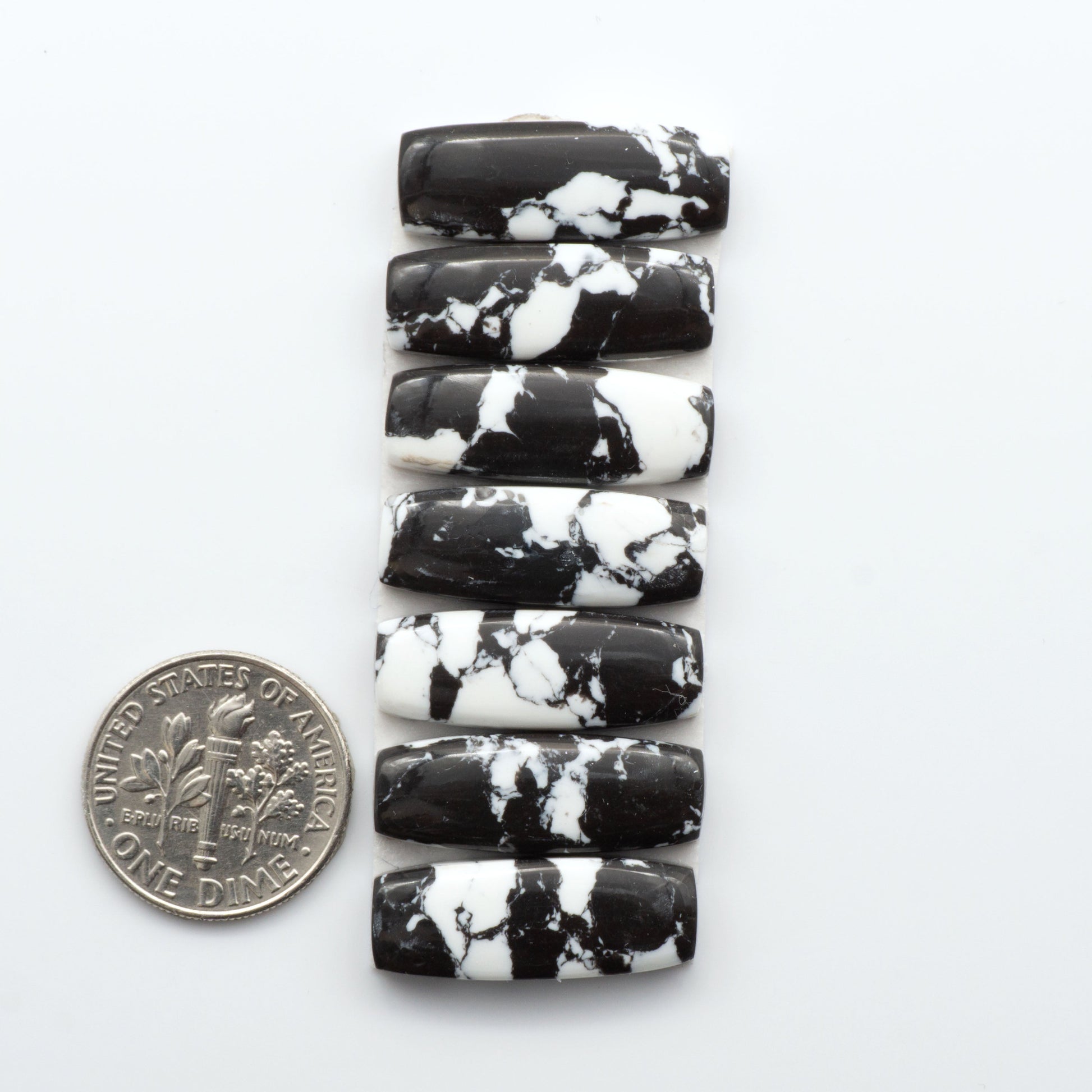 These White Buffalo Cabochons are expertly cut and polished from composite material, resulting in a stunning and long-lasting gemstone.