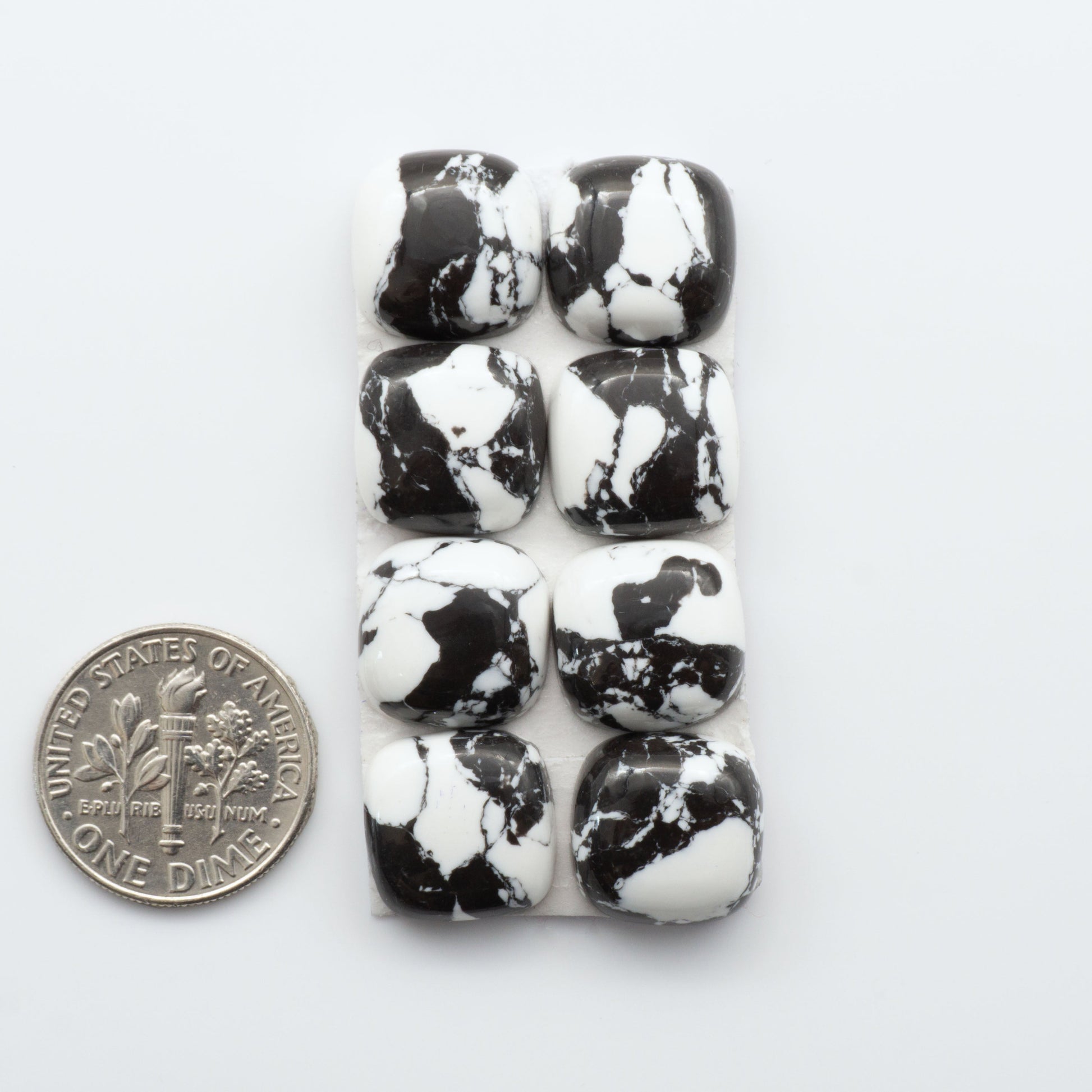 These White Buffalo Cabochons are expertly cut and polished from composite material, resulting in a stunning and long-lasting gemstone.