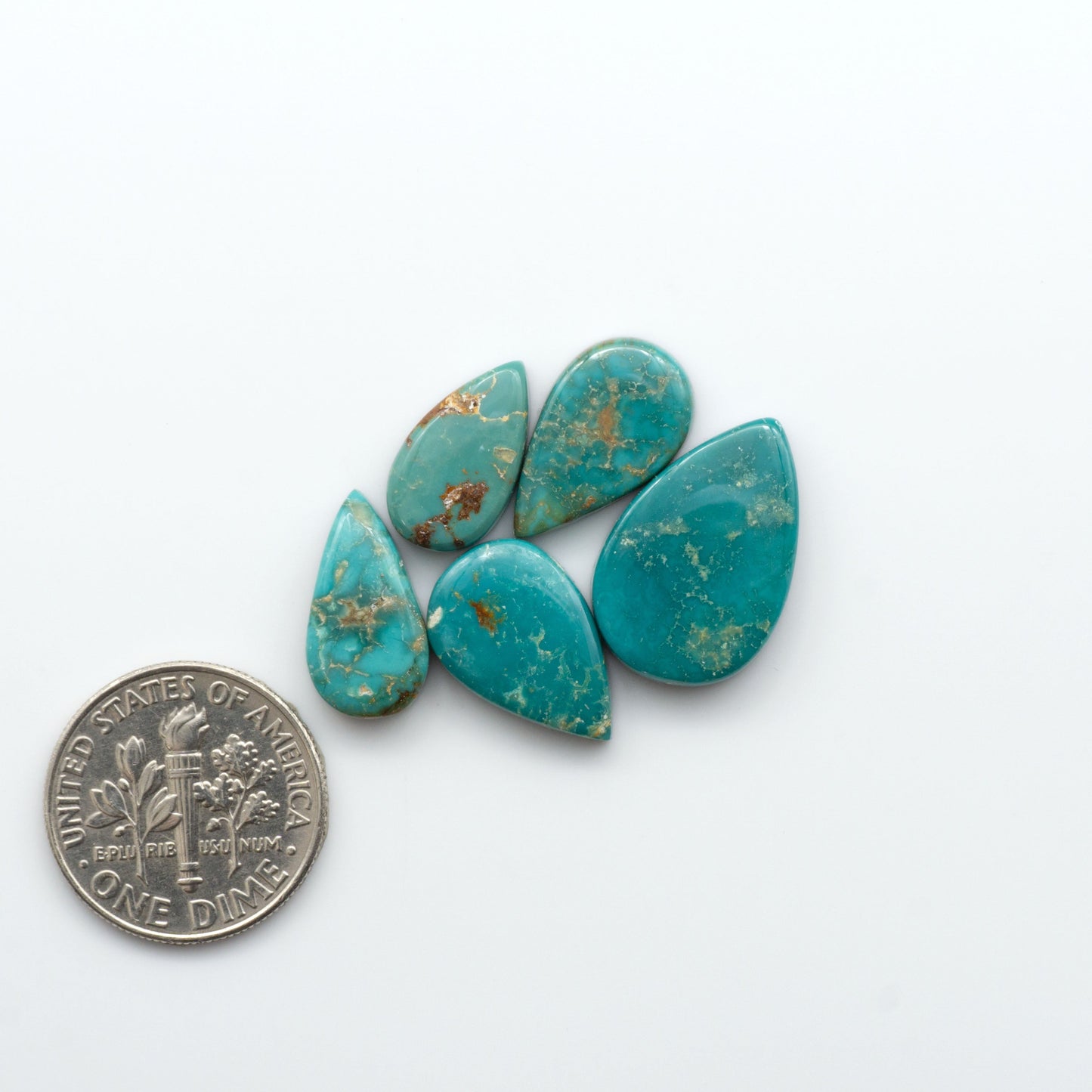 Royston Turquoise cabochons are famous for their distinctive matrix and unique green and blue hues, making them a favored option among jewelry designers.