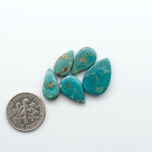 Royston Turquoise cabochons are famous for their distinctive matrix and unique green and blue hues, making them a favored option among jewelry designers.