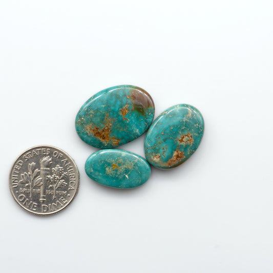 Royston Turquoise cabochons are famous for their distinctive matrix and unique green and blue hues, making them a favored option among jewelry designers.