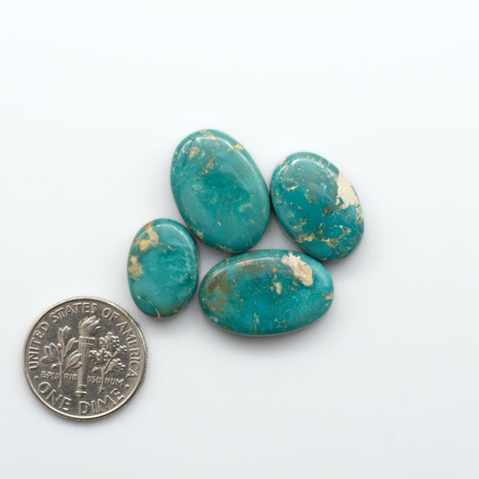 Royston Turquoise cabochons are famous for their distinctive matrix and unique green and blue hues, making them a favored option among jewelry designers.