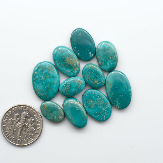 Royston Turquoise cabochons are famous for their distinctive matrix and unique green and blue hues, making them a favored option among jewelry designers.