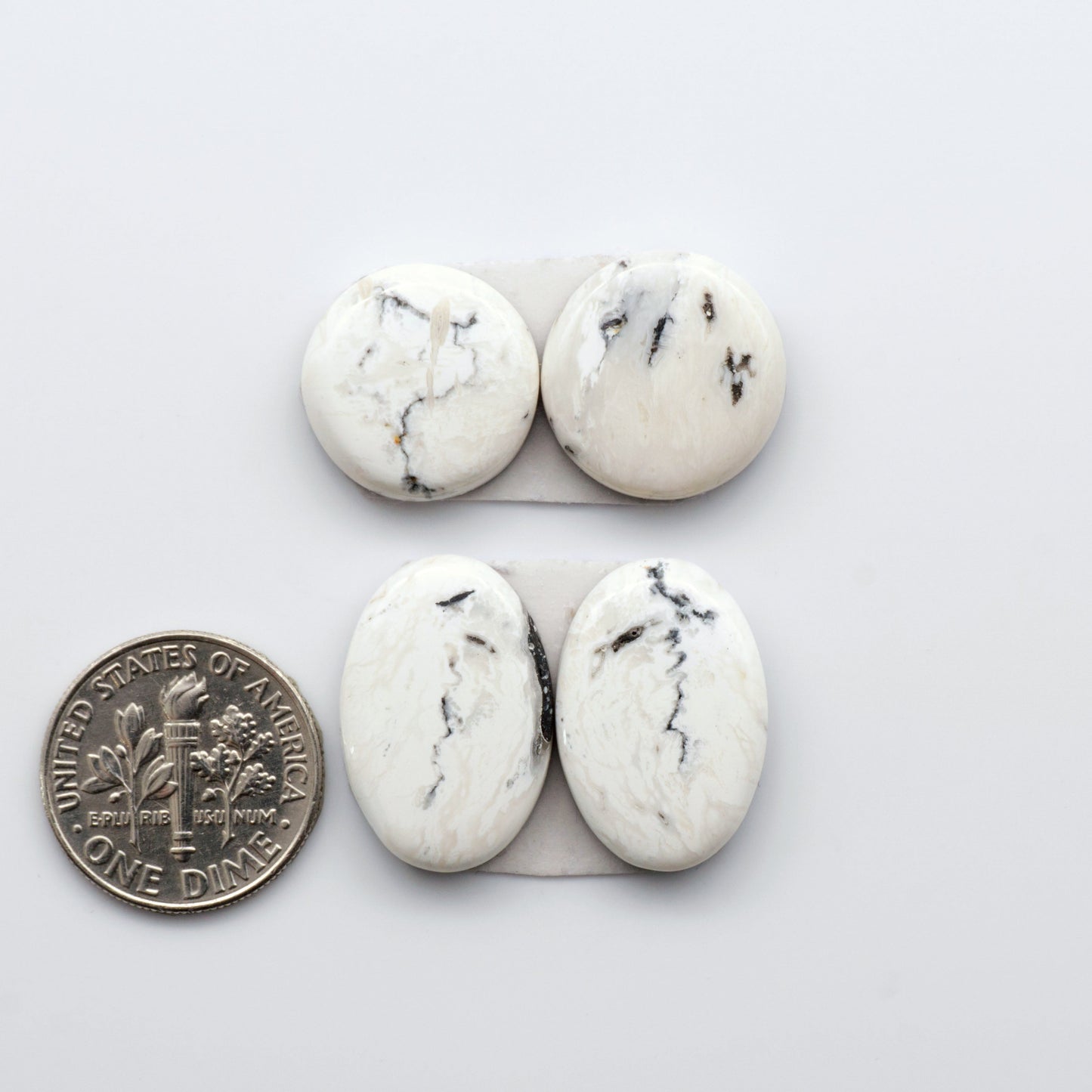 Natural White Buffalo Stone Cabochons are gemstones cut into shapes ideal for jewelry-making and crafting making them an excellent choice for artisans.