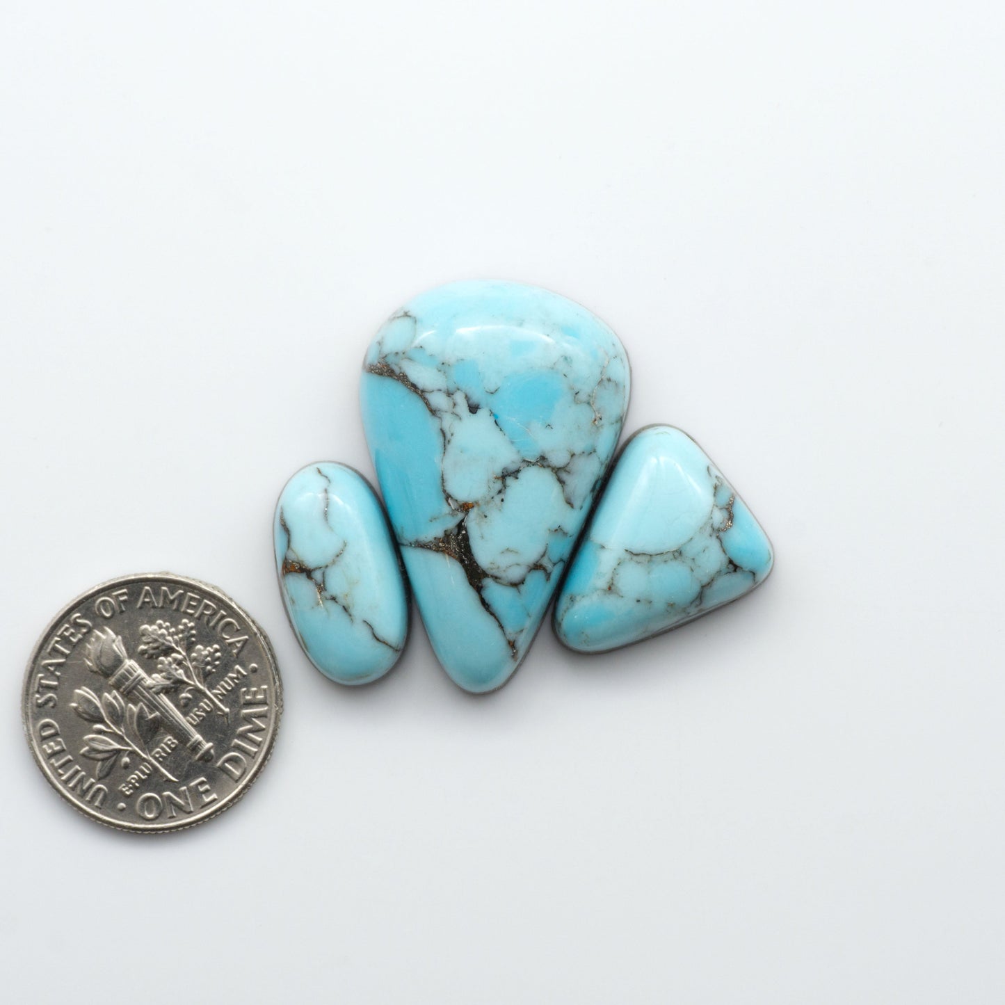 Enhance your jewelry designs with Pressed Turquoise Nugget Cabochons. Crafted from composite materials they add a captivating touch to your creations.