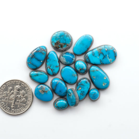 Experience the beauty of Turquoise Mountain Cabochons. With their distinctive blue color and black matrix these gemstones are perfect for any jewelry piece.