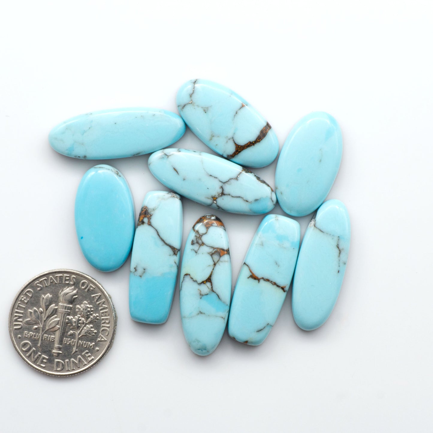 Enhance your jewelry designs with Pressed Turquoise Nugget Cabochons. Crafted from composite materials they add a captivating touch to your creations.