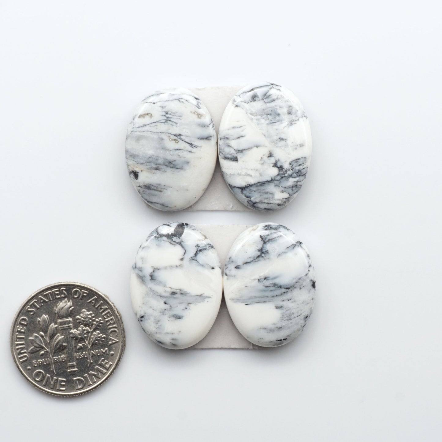 Natural White Buffalo Stone Cabochons are semi-precious gemstones cut into shapes ideal for jewelry-making, making them an excellent choice for artisans.